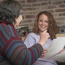 Smiling people talking.