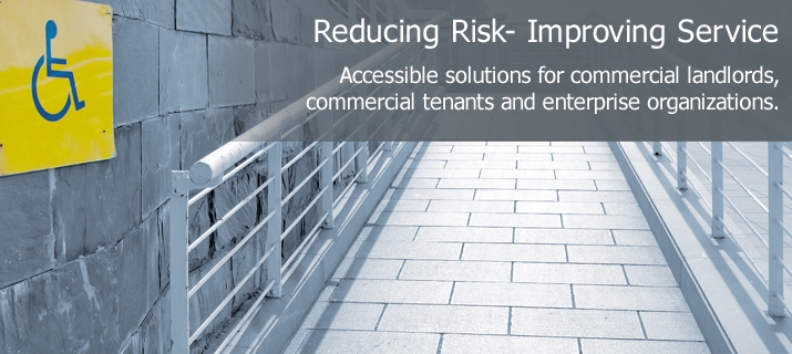 A wheelchair ramp with a yellow handicap sign.