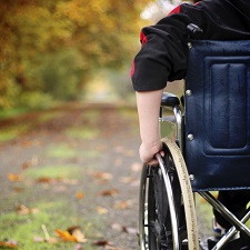 Boy in a wheelchair.